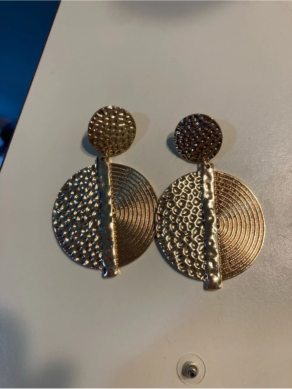 Large gold toned statement dangle earrings